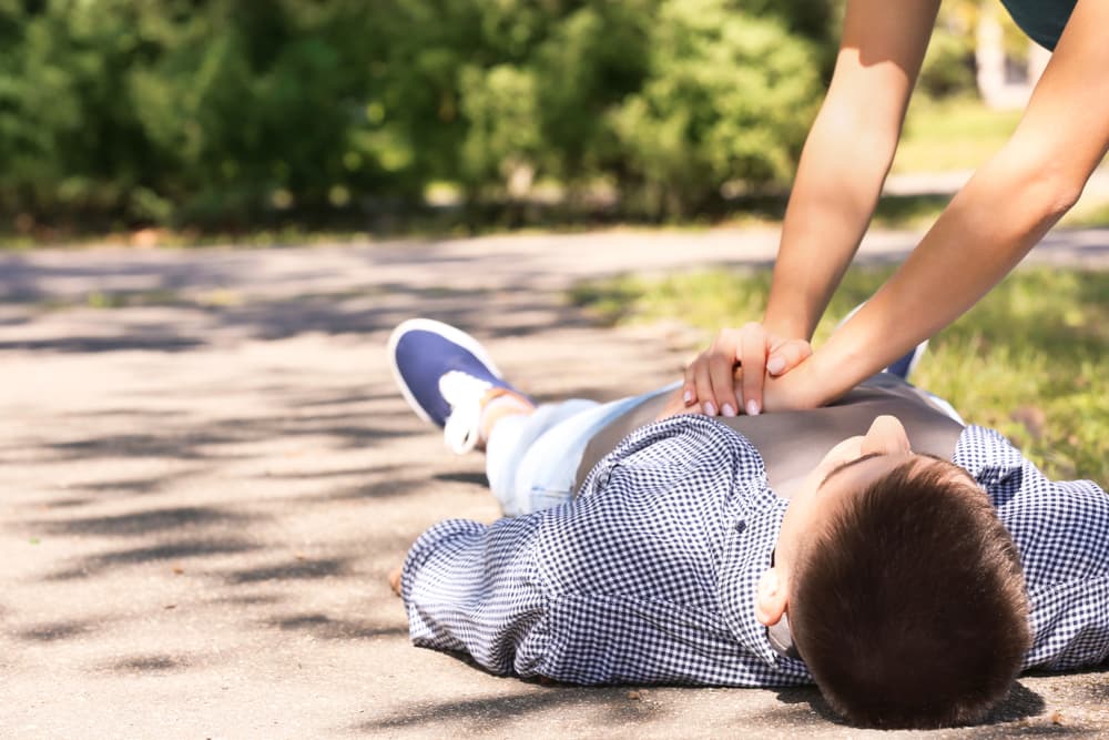 Passerby,Performing,Cpr,On,Unconscious,Man,Outdoors.,First,Aid affordable defibrillators