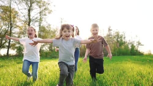 Group,Of,Children,Running,In,The,Park.,Happy,Family,Baby defibrillator on a child