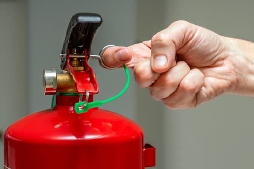 Closeup,Of,A,Male,Hand,Pulling,The,Safety,Pin,Of fire marshal training